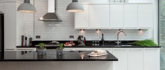 Black countertops on white kitchen cabinets