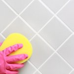 Clean tiles are wiped with a sponge