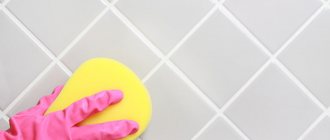 Clean tiles are wiped with a sponge