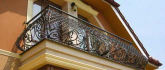 Forged balcony on the facade of a country house