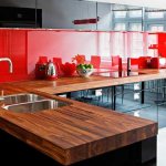 Red apron in the kitchen with black furniture