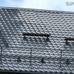 Installation of snow guards on a metal roof