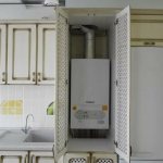 Wall-mounted gas boiler in a cabinet with lattice doors