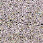Why does concrete crack when it hardens?