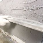 plastering the wall with gypsum