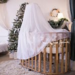 Tulle canopy on a wooden baby crib