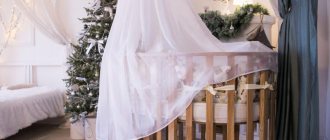 Tulle canopy on a wooden baby crib
