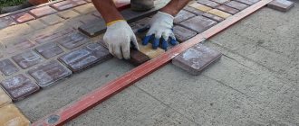Laying paving slabs on concrete