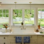 It is better to choose light-loving plants for a kitchen with large windows.